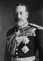 Pale-eyed grey-bearded man of slim build wearing a dress uniform and medals