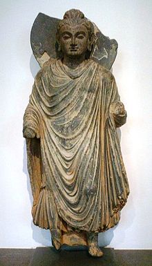 Standing Buddha sculpture, ancient region of Gandhara, northern Pakistan, 1st century CE, Musée Guimet, Paris.