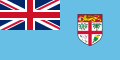 Sky Blue flag with Union Flag as top-left quarter and crest on right side.