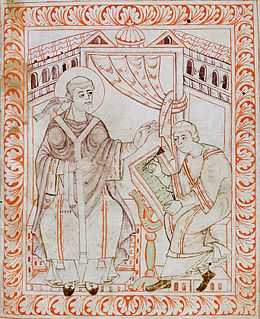 Dessin de style médiéval montrant deux hommes assis en habits de moines. L'un d'eux écrit sur un livre placé sur un pupitre.